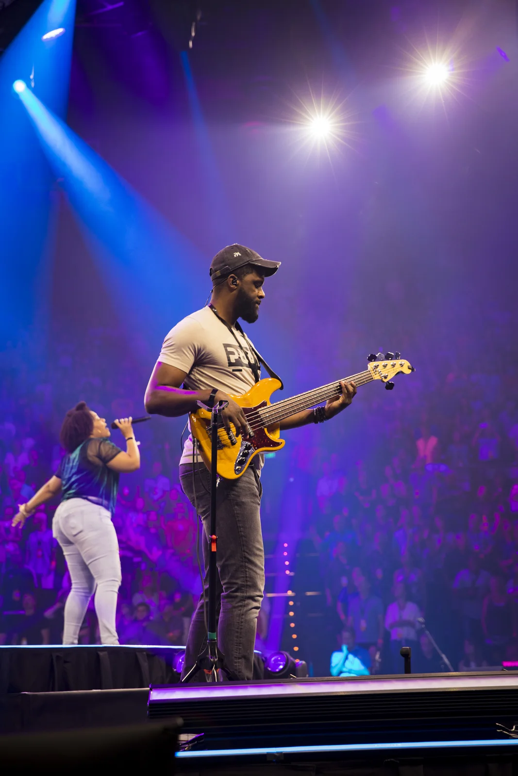 Bassist performing on stage at Cru 2019 conference