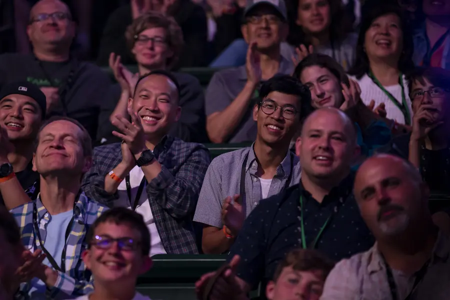 Conference audience applauding during a session