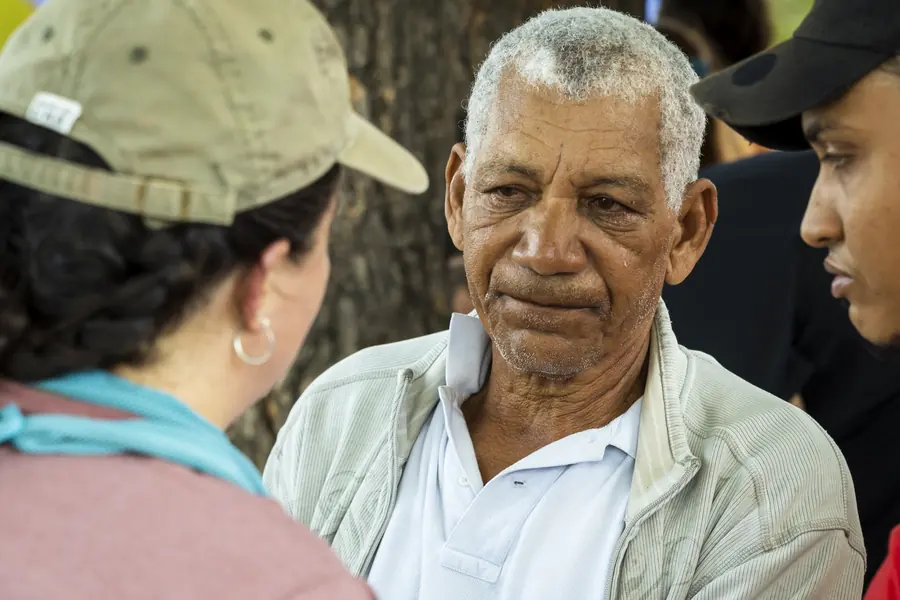 Portrait of an older man at a community gathering, Dominican Republic