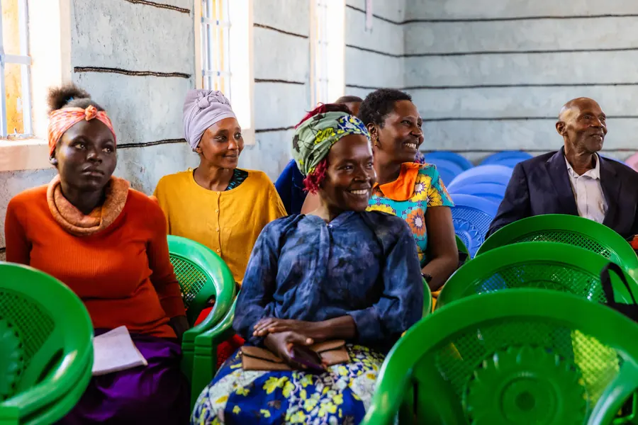 Row of women laughing during a church gathering, Africa
